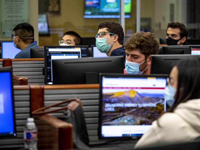 Students in an early morning business class wear masks as required for in-person classes.