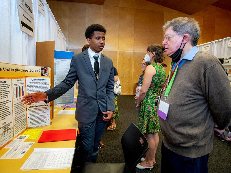 Jaymon Williams, a freshman at John Curtis, shares how temperature affects the pH of orange juice. 