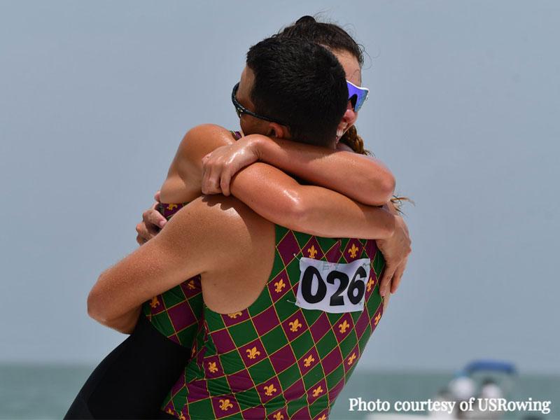 Hannah and John Huppi embrace after competing in the Beach Sprint Trials. The crew won the trials for their boat class with a time of 2 minutes, 32.7 seconds. 