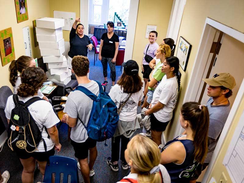 A dozen students receive instructions while volunteering with Start the Adventure in Reading (STAIR) in Uptown New Orleans.
