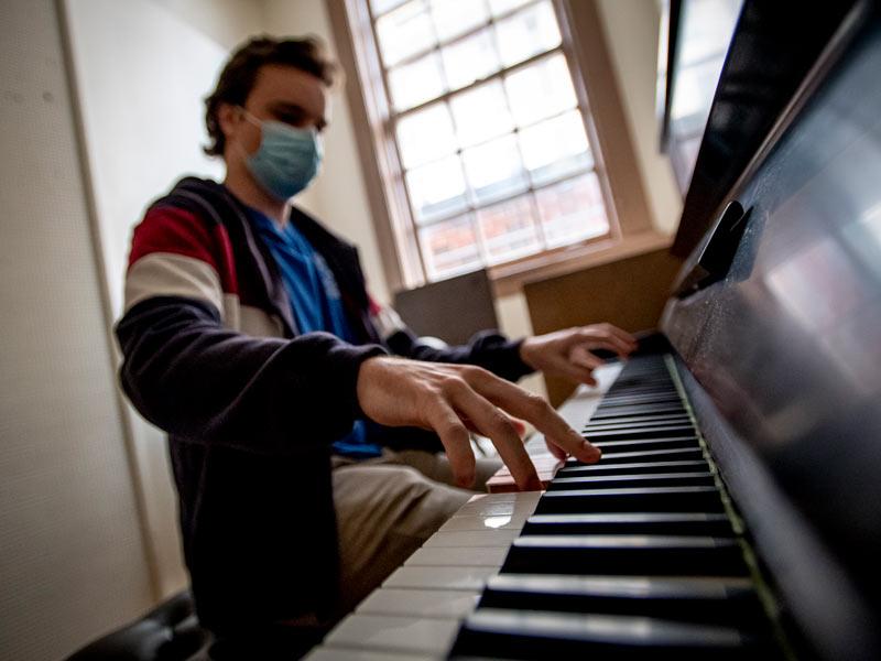 With time between classes, Tulane junior Jack Henshaw, a double major in music and political science, plays a rendition of ‘Tea For Two’ in a practice room in Dixon Hall. 