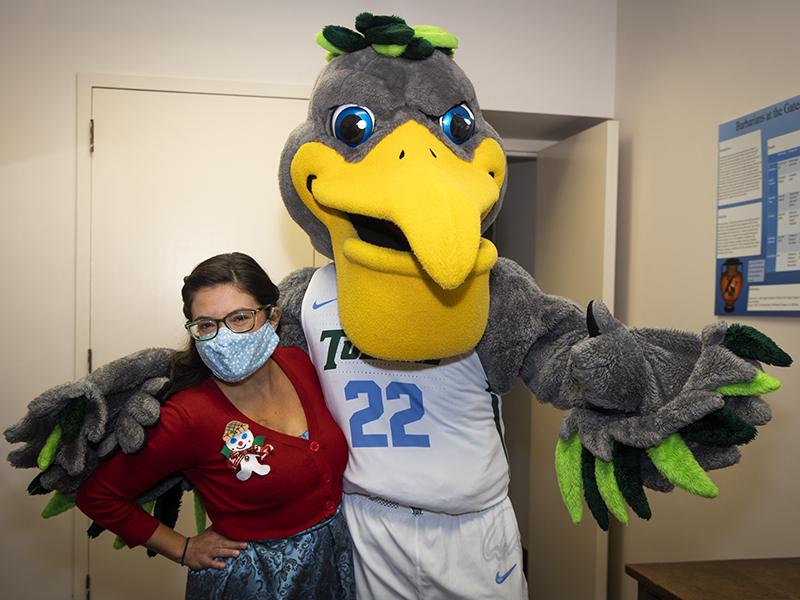 Elizabeth Reyna, executive secretary for the Department of Classical Studies at the School of Liberal Arts, poses with Riptide. Elizabeth Reyna, executive secretary for the Department of Classical Studies at the School of Liberal Arts, poses with Riptide.