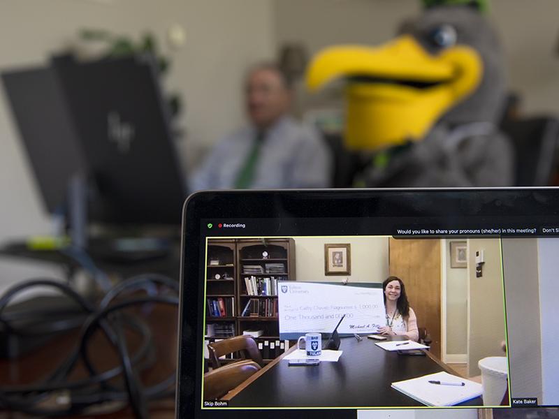 Cathy Chavez-Tsagournos, assistant director for animal resources in the Division of Veterinary Medicine at the Tulane National Primate Research Center, receives her award via Zoom. 