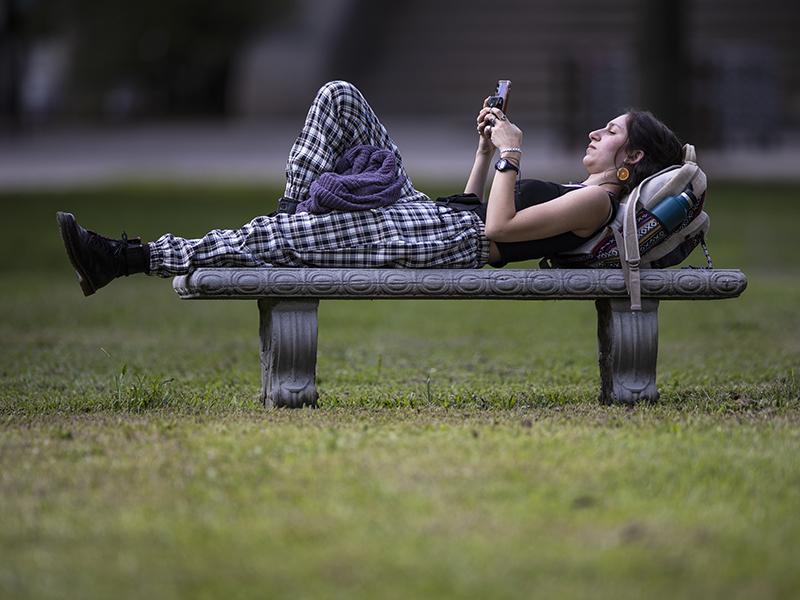 Tulane sophomore, Sara Miller of New Orleans, rests on a bench before her class begins.
