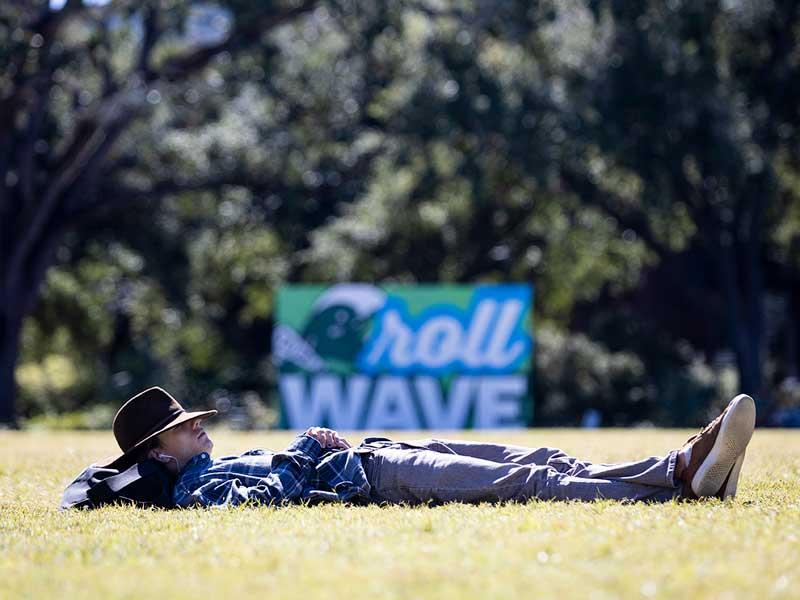 Tulane University first year student, Jameson Brewster, listens to a podcast while relaxing on the Berger Family Lawn 