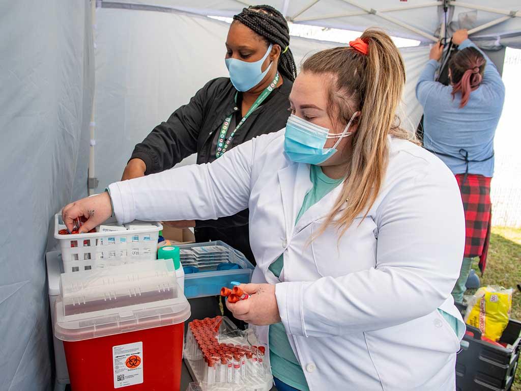 Phlebotomy staff preparing for COVID-19 tests during Tulane School of Public Health Compass Study 