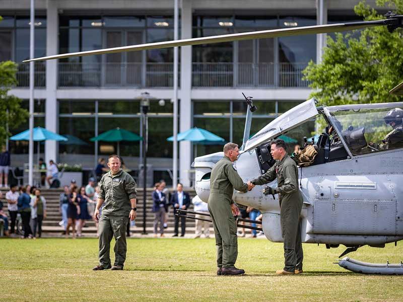 Tulane Naval ROTC Commanding Officer, Capt. Paul D. Bowdich, second from left, greets U.S. Marine Corps pilot Lt. Col. P.W. Richardson.