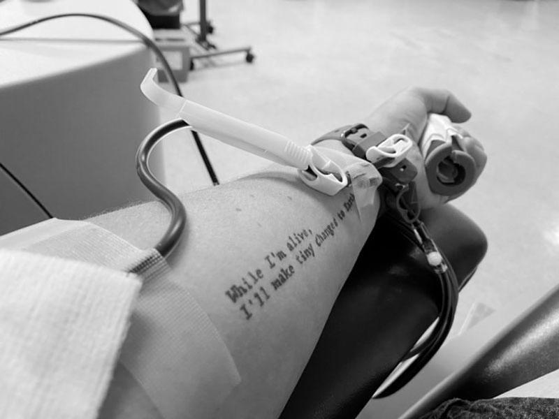 Person donating blood at blood drive