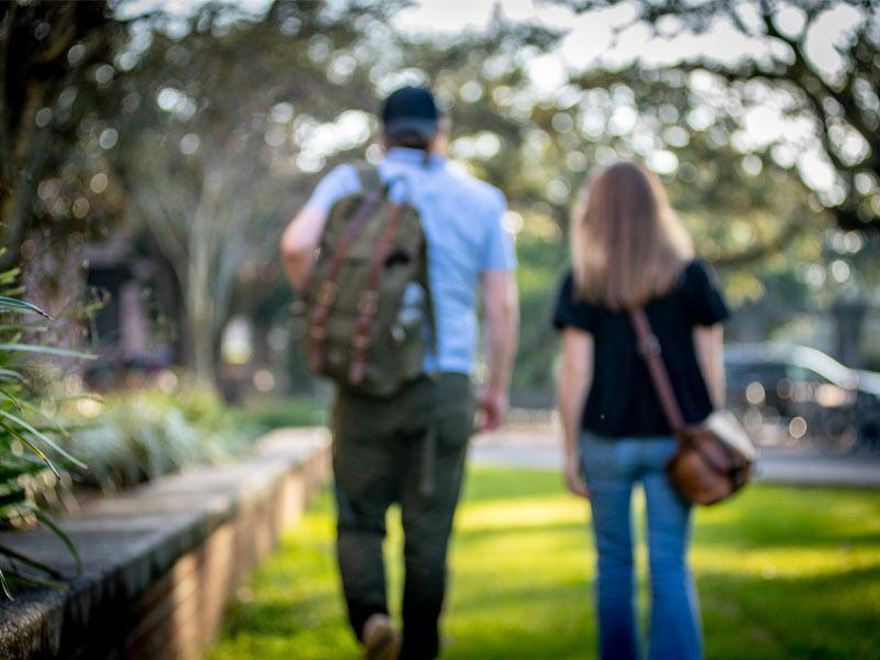 Two students walk on campus