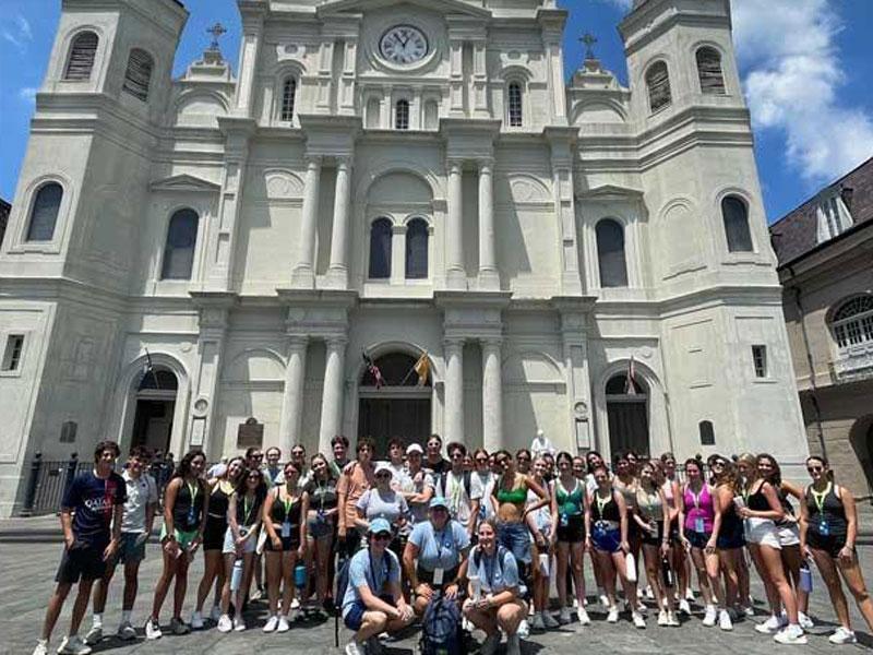 First year students pose for photo in front of the cathedral in Jackson Square