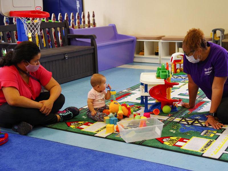 Childcare center employees with child
