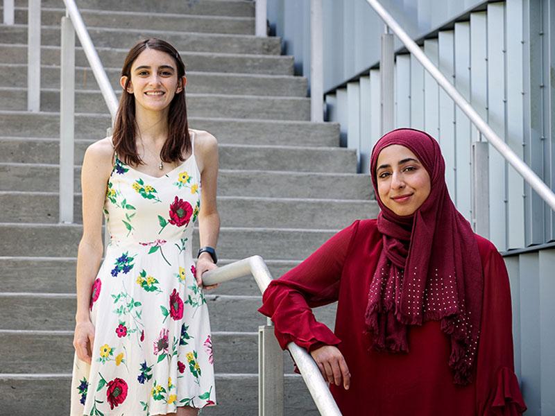 Margaret Conrad (left) and Amna Ashraf (right) pose for photo