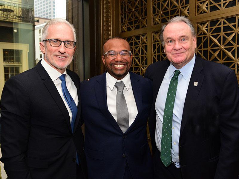 President Michael Fitts (right) joins Jim Coulter (left), executive chairman and founding partner of the global private equity firm TPG, and Daryn Dodson (center)
