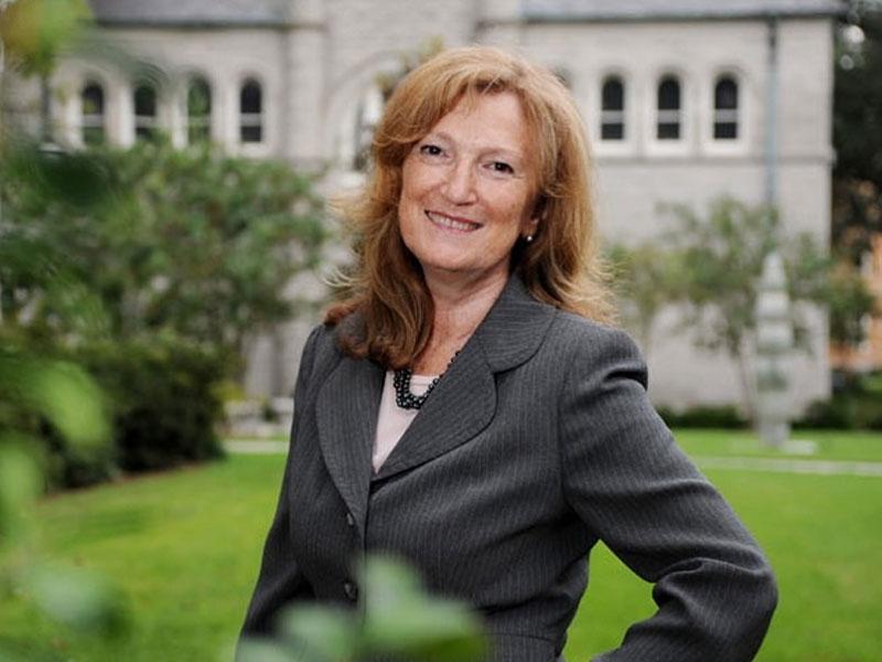 Nora Lustig poses for photo on campus