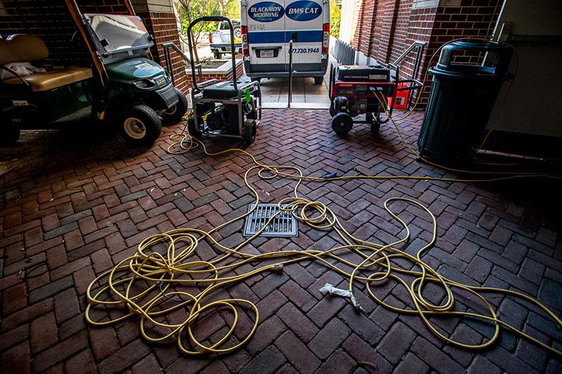 Generators hum outside the Tulane School of Law. 