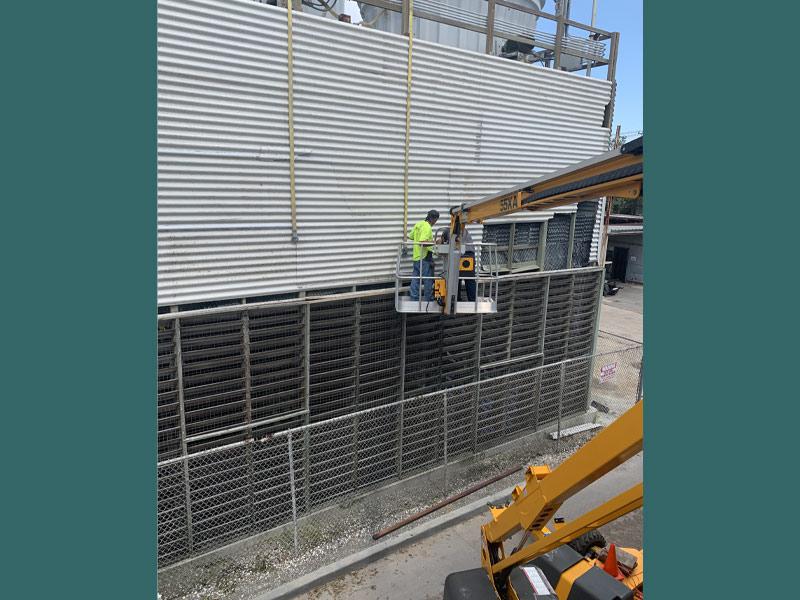 Contractors make repairs to the chilled water plant on campus. (Photo by Kate Simon) 