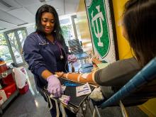 Student takes a timeout to give blood.
