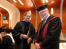 Dr. Pierre Buekens, right, dean of the School of Public Health and Tropical Medicine (seen here with Ronald Marks, dean of the School of Social Work