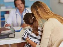 Pediatrician talking to parent