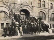 An anonymous group is captured on the steps of Gibson Hall.