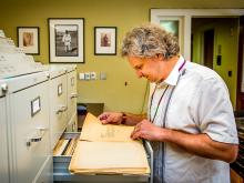 Marcello Canuto, director of Middle American Research Institute (MARI), views files from the 1920s that relate to the beginning of the institute. 