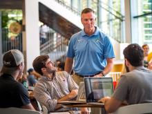 Head football coach Willie Fritz stops to speak to students during a meet and greet event at the Lavin-Bernick Center on Wednesday (Sept. 7).
