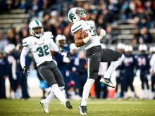 Larry Bryant, a freshman linebacker from Georgia, celebrates blocking and recovering a punt in the first quarter of the Green Wave’s 38-13 victory over UConn in East Hartford on Saturday (Nov. 26). 