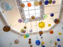 Hand-blown glass ornaments hang from the ceiling of the Carroll Gallery on display for the annual Newcomb Art Department Holiday Sale.