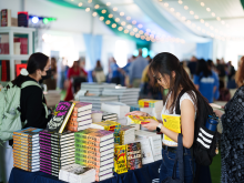 Person looking at books at BookFest 2024
