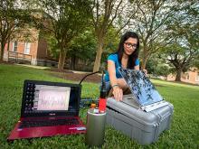 Sarah Oliva, a PhD student in earth and environmental sciences tests a seismometer in the quad near Blessey Hall. The state of the art equipment is headed for New Zealand where it will monitor unusual volcanic earthquakes. The data will help researchers u Sarah Oliva, a PhD student in earth and environmental sciences tests a seismometer in the quad near Blessey Hall. The state of the art equipment is headed for New Zealand where it will monitor unusual volcanic earthquakes. The data will help researchers u
