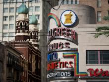 At the corner of Canal and Baronne Streets in downtown New Orleans, an interesting mix of architectural styles can be seen including the modern design of the Walgreens Pharmacy and the Neo-Venetian Gothic style of the Immaculate Conception church, known t