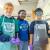2 Tulane Science Olympiad participants with a student organizer