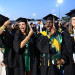 Graduates turn the tassels on their mortarboards, representing their shift from students to graduates. (Photo by Cheryl Gerber)